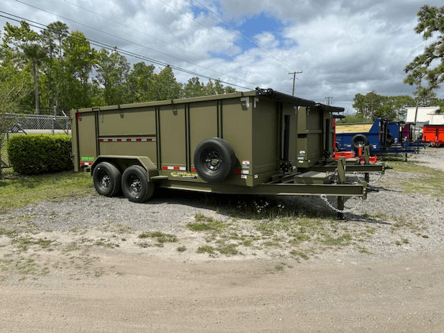 A large roll-off dumpster ready for land clearing and debris removal.